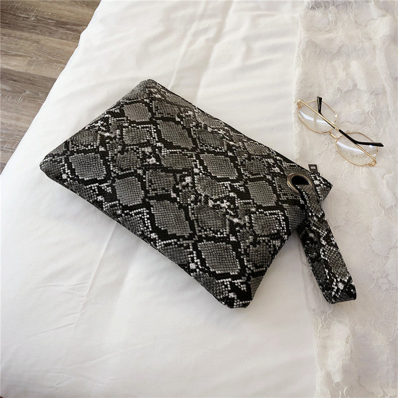 Snake print clutch