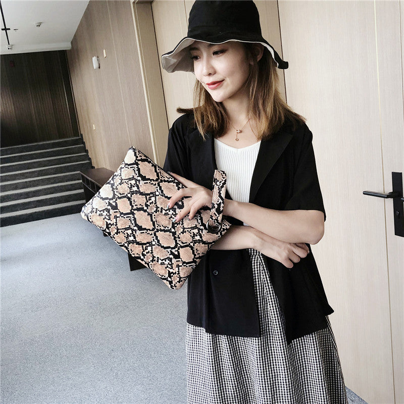 Snake print clutch